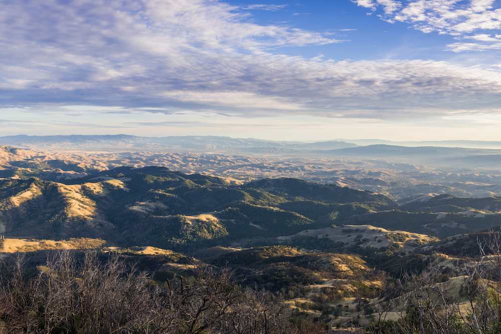 Panoramic view at sunset from the summit of Mt Diablo, Pleasanton, Livermore and the bay covered in fog in the background, Mt Diablo SP, Contra Costa county, San Francisco bay area, California